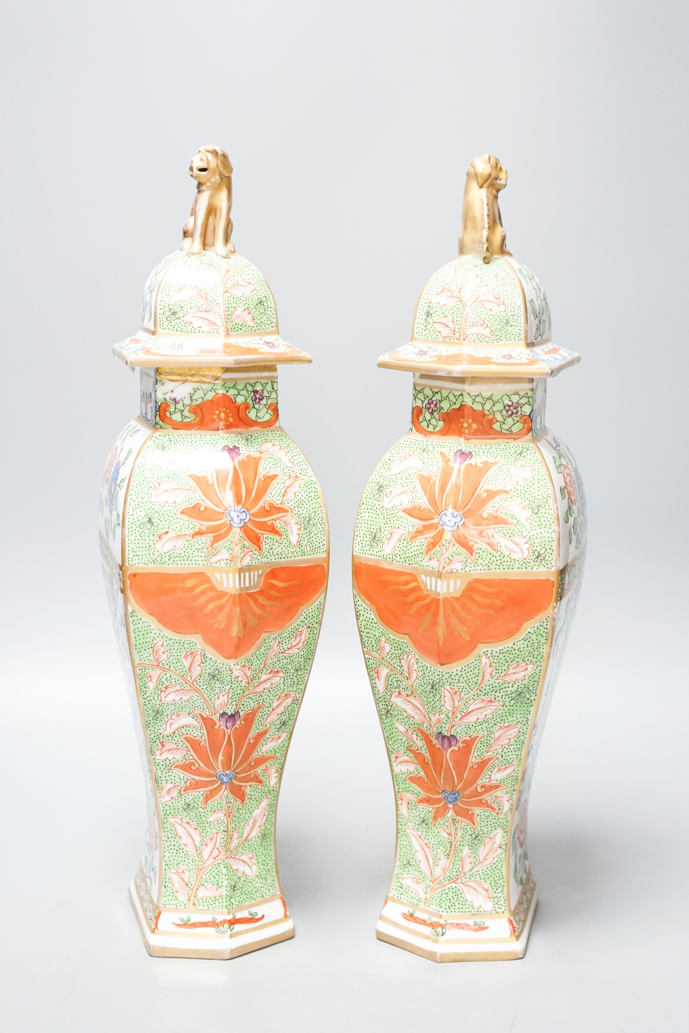 A pair of Samson kakiemon style lidded hexagonal baluster vases 41cm